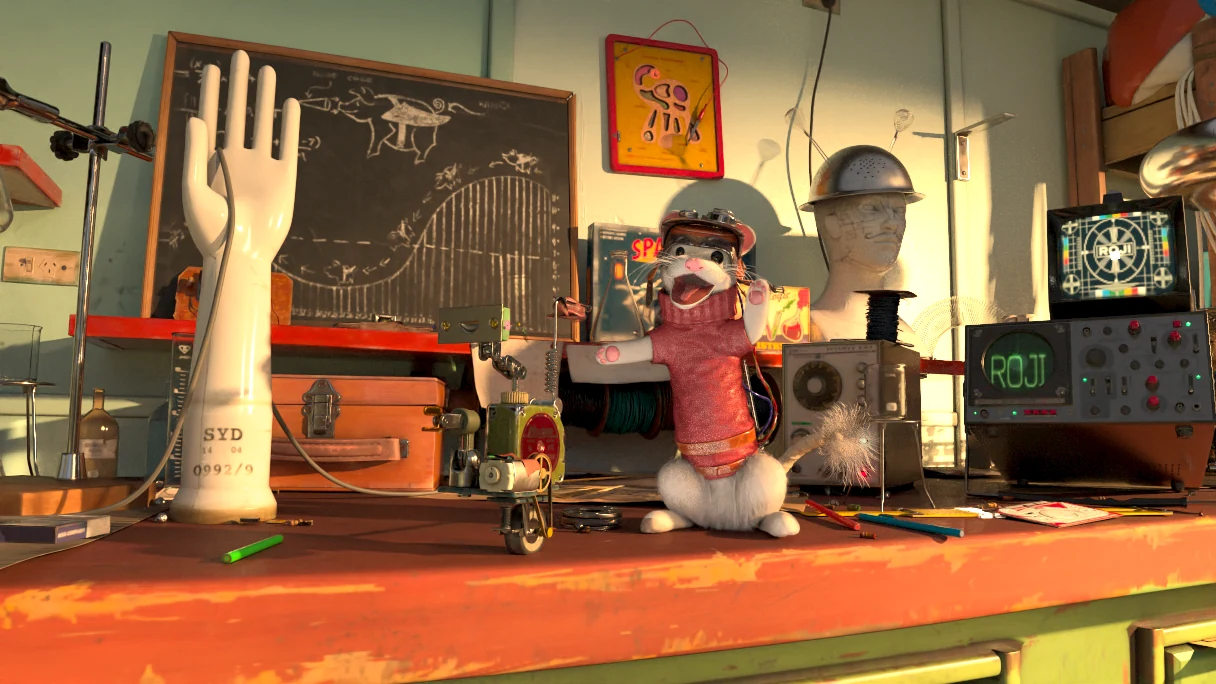 Animal Logic ALab rendered on Roji XPU: a workshop bench with a plaster hand, a mouse in a knitted jumper and glowing monitors.